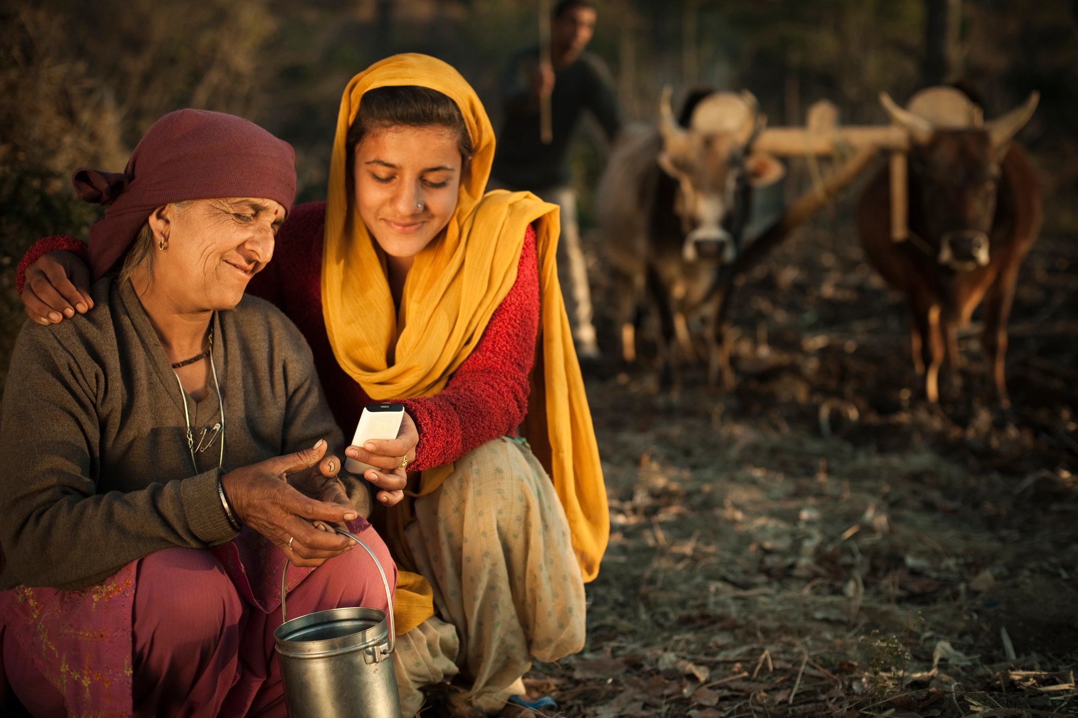 Rural family learning on a mobile phone together